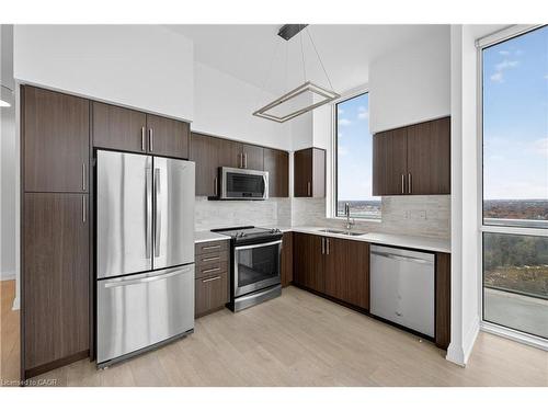 Ph03-65 Speers Road, Oakville, ON - Indoor Photo Showing Kitchen With Double Sink