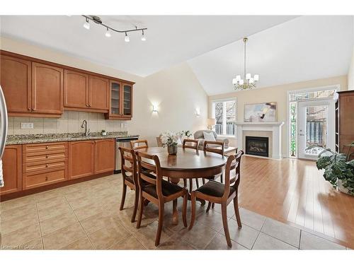 99-2125 Itabashi Way, Burlington, ON - Indoor Photo Showing Other Room With Fireplace