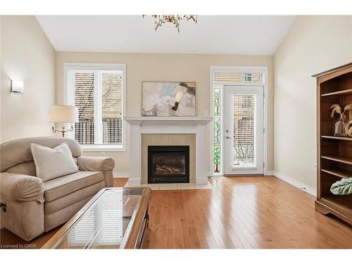 99-2125 Itabashi Way, Burlington, ON - Indoor Photo Showing Living Room With Fireplace