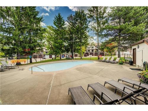 4-493 Beechwood Drive, Waterloo, ON - Outdoor With In Ground Pool