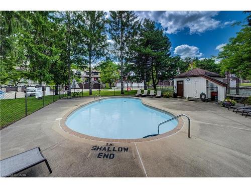 4-493 Beechwood Drive, Waterloo, ON - Outdoor With In Ground Pool