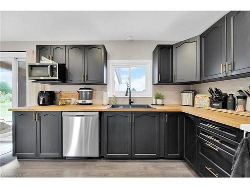 1073 Concession 6 Woodhouse Road, Simcoe, ON - Indoor Photo Showing Kitchen With Double Sink
