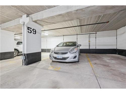 104-15 Prince Albert Boulevard, Kitchener, ON - Indoor Photo Showing Garage