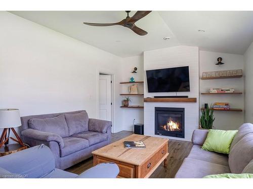 197 Cedar Drive, Turkey Point, ON - Indoor Photo Showing Living Room With Fireplace