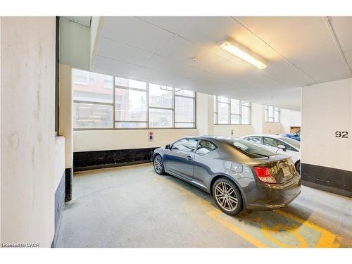 703-85 Duke Street W, Kitchener, ON - Indoor Photo Showing Garage