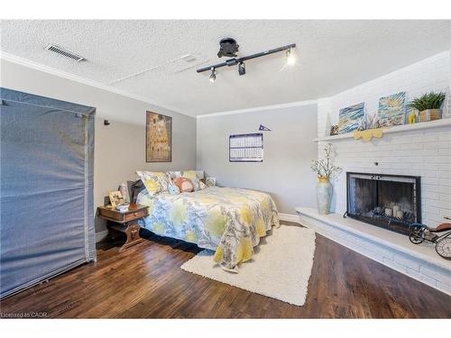 627 Pineridge Road, Waterloo, ON - Indoor Photo Showing Bedroom With Fireplace