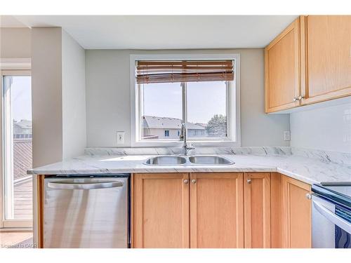 63-1489 Heritage Way, Oakville, ON - Indoor Photo Showing Kitchen With Stainless Steel Kitchen With Double Sink