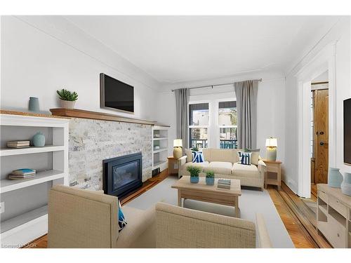 67 Kensington Avenue S, Hamilton, ON - Indoor Photo Showing Living Room With Fireplace
