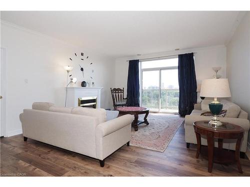 701-255 Keats Way, Waterloo, ON - Indoor Photo Showing Living Room With Fireplace