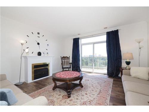 701-255 Keats Way, Waterloo, ON - Indoor Photo Showing Living Room With Fireplace