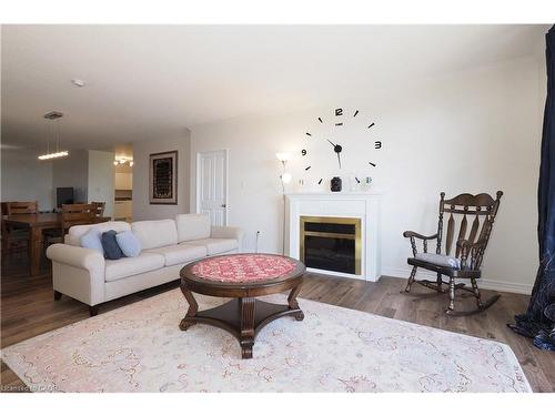 701-255 Keats Way, Waterloo, ON - Indoor Photo Showing Living Room With Fireplace