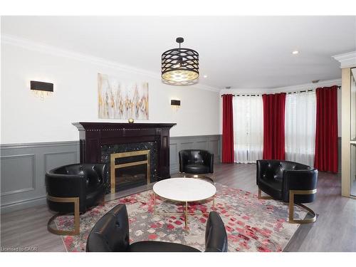 701-255 Keats Way, Waterloo, ON - Indoor Photo Showing Living Room With Fireplace