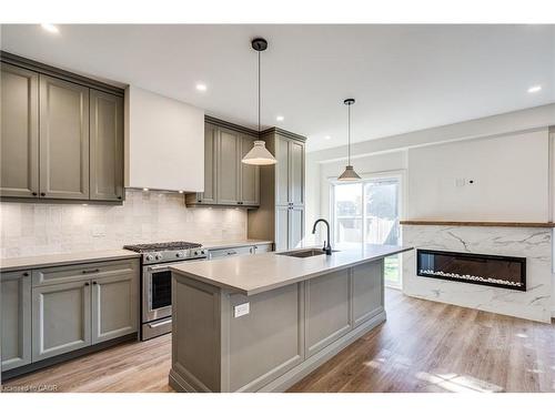 14 Olivia Place, Ancaster, ON - Indoor Photo Showing Kitchen With Fireplace With Upgraded Kitchen