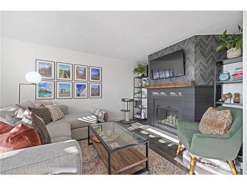 901-700 Dynes Road, Burlington, ON - Indoor Photo Showing Living Room With Fireplace