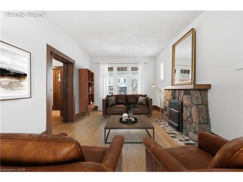 110 Houghton Avenue S, Hamilton, ON - Indoor Photo Showing Living Room With Fireplace