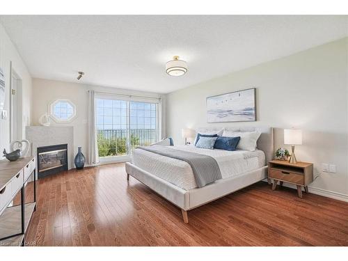 55 Edgewater Drive, Stoney Creek, ON - Indoor Photo Showing Bedroom With Fireplace
