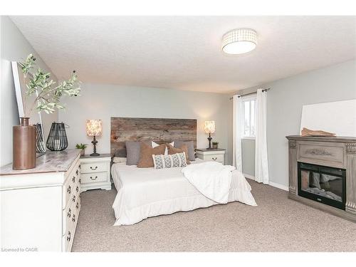 159 Country Clair Street, Kitchener, ON - Indoor Photo Showing Bedroom With Fireplace