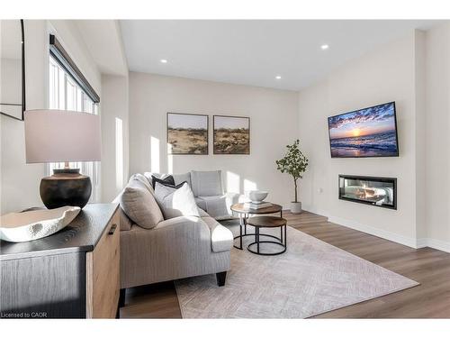 25-205 Thames Way, Mount Hope, ON - Indoor Photo Showing Living Room With Fireplace