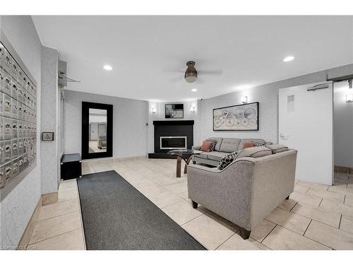 220-198 Scott Street, St. Catharines, ON - Indoor With Fireplace