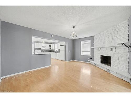 76 Main Street E, Mapleton, ON - Indoor Photo Showing Living Room With Fireplace