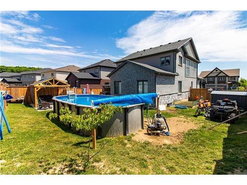 39 Basswood Road, Simcoe, ON - Outdoor With Above Ground Pool With Backyard