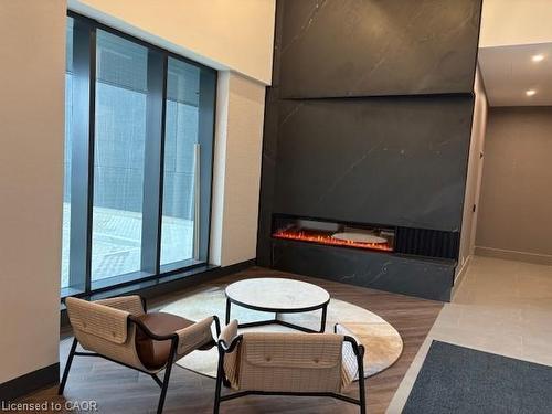 717-1007 The Queensway, Toronto, ON - Indoor Photo Showing Other Room With Fireplace