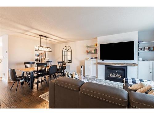 12-230 Blackhorne Drive, Kitchener, ON - Indoor Photo Showing Living Room With Fireplace