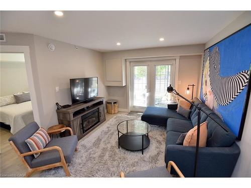 103-2035 Appleby Line, Burlington, ON - Indoor Photo Showing Living Room With Fireplace