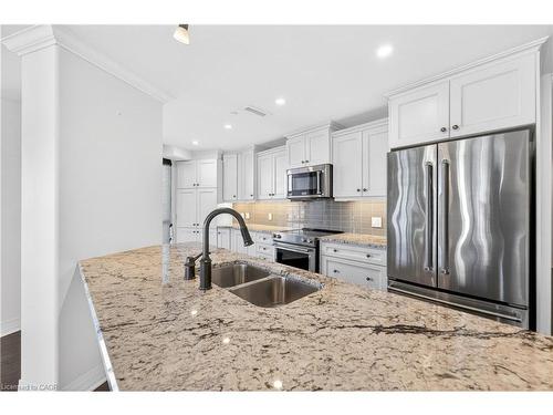 408-10 Concord Place, Grimsby, ON - Indoor Photo Showing Kitchen With Double Sink With Upgraded Kitchen
