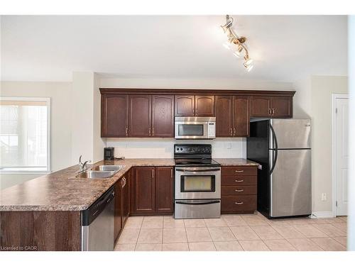 23-222 Fall Fair Way, Binbrook, ON - Indoor Photo Showing Kitchen With Double Sink