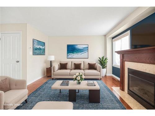 23-222 Fall Fair Way, Binbrook, ON - Indoor Photo Showing Living Room With Fireplace