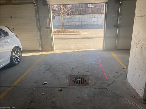 302-155 Water Street S, Cambridge, ON - Indoor Photo Showing Garage