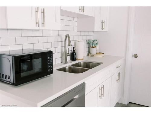 B-261 Belmont Avenue W, Kitchener, ON - Indoor Photo Showing Kitchen With Double Sink