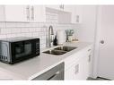 B-261 Belmont Avenue W, Kitchener, ON  - Indoor Photo Showing Kitchen With Double Sink 