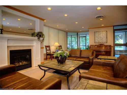 2203-6 Willow Street, Waterloo, ON - Indoor Photo Showing Living Room With Fireplace