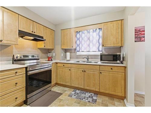 116-185 Denistoun Street, Welland, ON - Indoor Photo Showing Kitchen With Double Sink