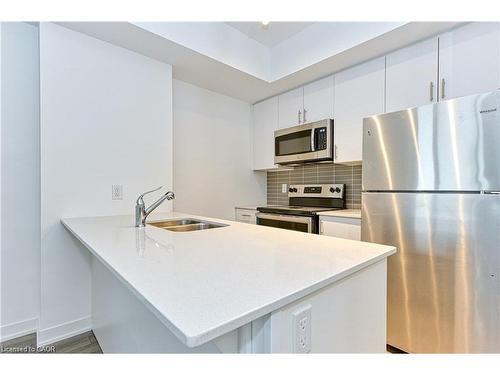 602-550 North Service Road, Grimsby, ON - Indoor Photo Showing Kitchen With Double Sink