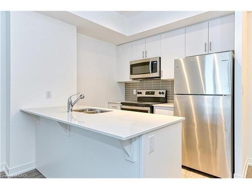 602-550 North Service Road, Grimsby, ON - Indoor Photo Showing Kitchen With Double Sink