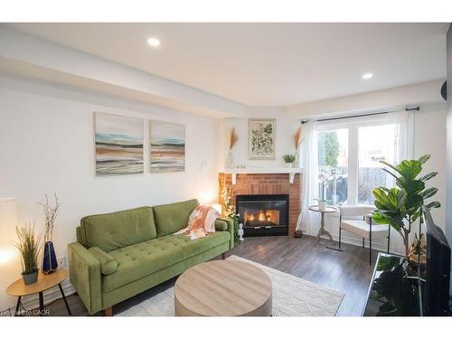 12-2350 Grand Ravine Drive, Oakville, ON - Indoor Photo Showing Living Room With Fireplace