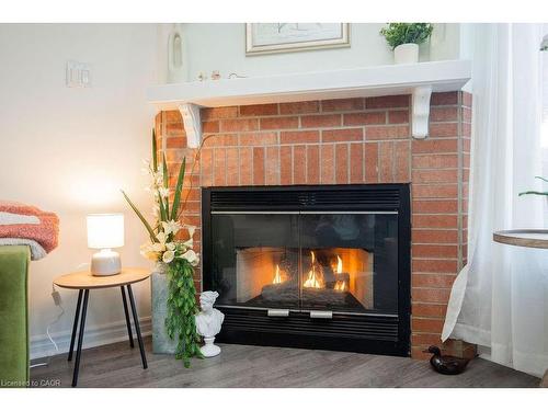 12-2350 Grand Ravine Drive, Oakville, ON - Indoor Photo Showing Living Room With Fireplace