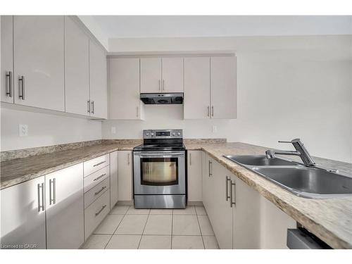 76 Prest Way, Centre Wellington, ON - Indoor Photo Showing Kitchen With Double Sink