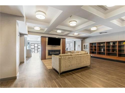 910-150 Main Street W, Hamilton, ON - Indoor With Fireplace