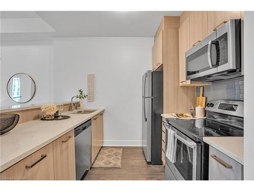 910-150 Main Street W, Hamilton, ON - Indoor Photo Showing Kitchen With Stainless Steel Kitchen With Double Sink With Upgraded Kitchen