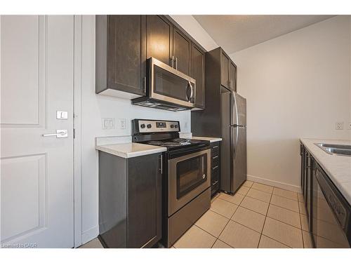 706-2486 Old Bronte Road, Oakville, ON - Indoor Photo Showing Kitchen With Double Sink