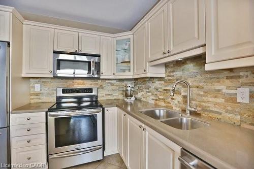368 Cavanagh Lane, Milton, ON - Indoor Photo Showing Kitchen With Double Sink