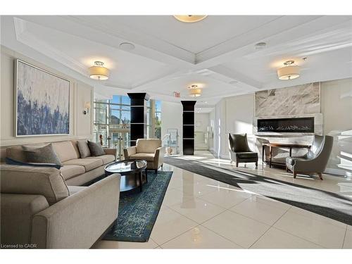 1009-144 Park Street, Waterloo, ON - Indoor Photo Showing Living Room With Fireplace