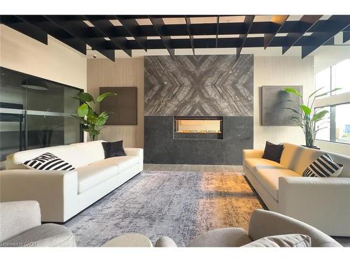 501-8020 Derry Road, Milton, ON - Indoor Photo Showing Living Room With Fireplace