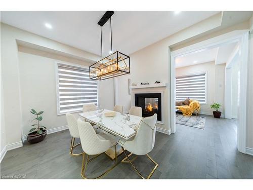 3444 Mosley Gate, Oakville, ON - Indoor Photo Showing Dining Room With Fireplace