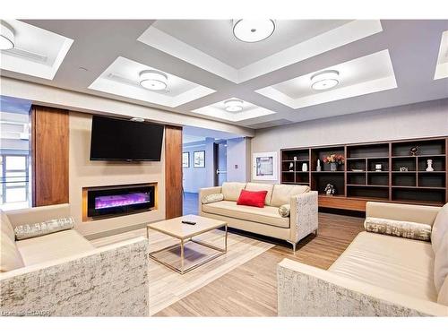 1011-150 Main Street W, Hamilton, ON - Indoor Photo Showing Living Room With Fireplace