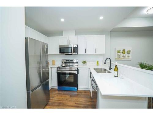 107-7 Kay Crescent, Guelph, ON - Indoor Photo Showing Kitchen With Double Sink